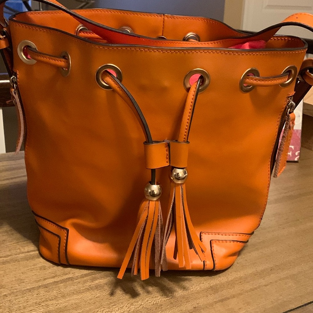 Gorgeous orange/brown purse. 11x13 in excellent condition from smoke free home.